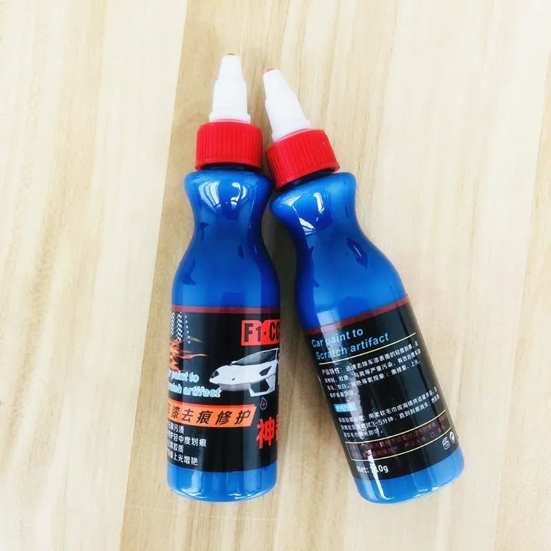 Blue car scratch repair agent container with microfiber cloth for minor automotive surface imperfections