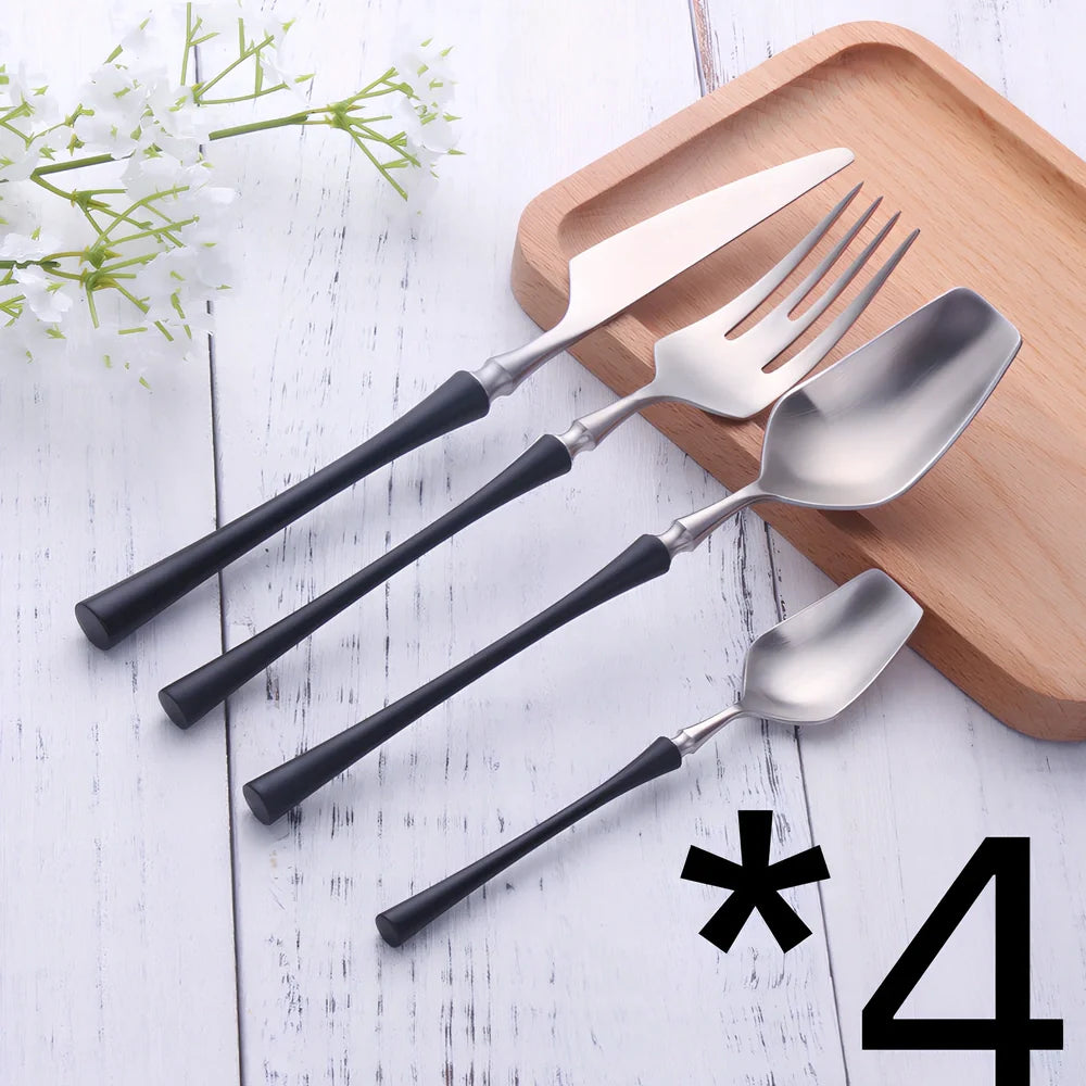 Four-piece stainless steel cutlery set showing main knife, fork, spoon, and teaspoon with mirror finish