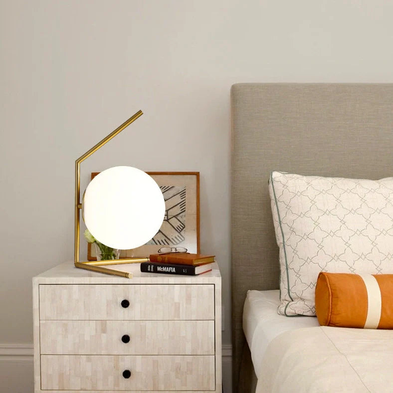 Clear glass spherical table lamp with aluminium base showing dual-colour LED lighting options