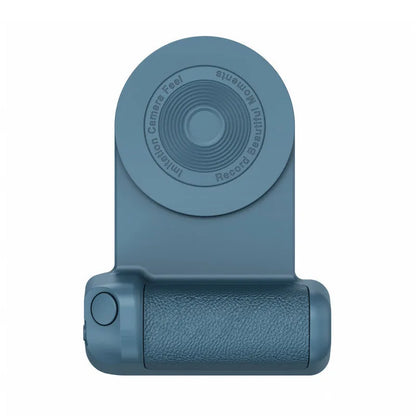 Black magnetic phone camera grip holder with rotatable stand on a table next to a smartphone.