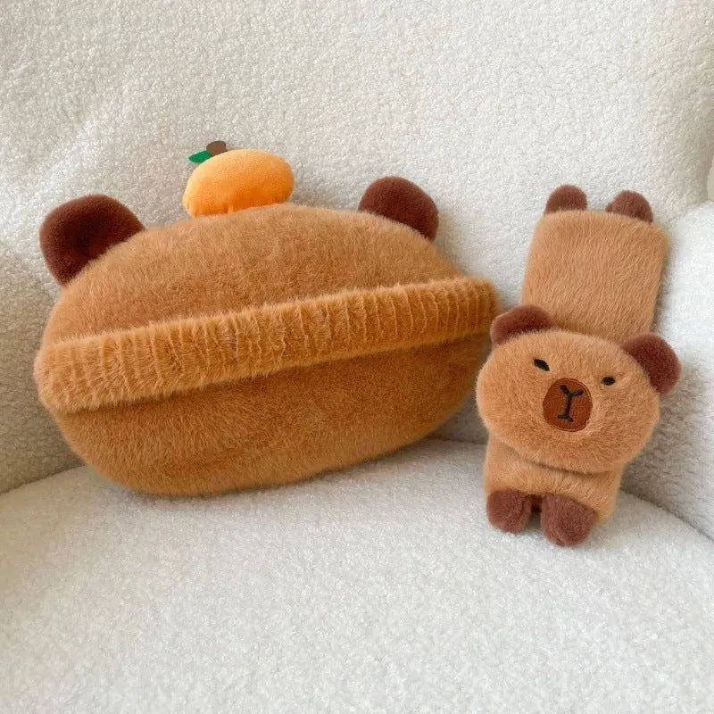 Khaki capybara car pillow in artificial plush with synthetic fibre filling, shown as a car neck pillow or shoulder cover.