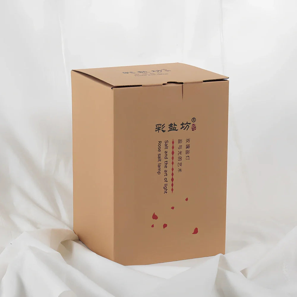 Crystal salt bedside lamp with glass shade and USB cable on wooden table