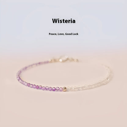 Purple geometric crystal bracelet threaded on 2mm purple rattan.