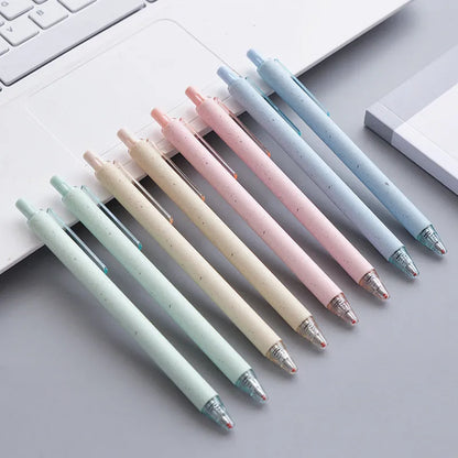 Set of 12 coloured 0.5mm gel pens with black ink and press-button tops on a white surface.