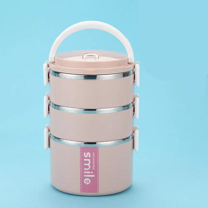 Stainless steel lunch box with built-in spoon, leak-proof design, available in green, pink, and blue