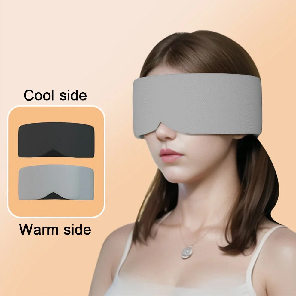 Gray double-sided sleep mask showing cool ice silk side and warm cotton side with adjustable magic tape closure