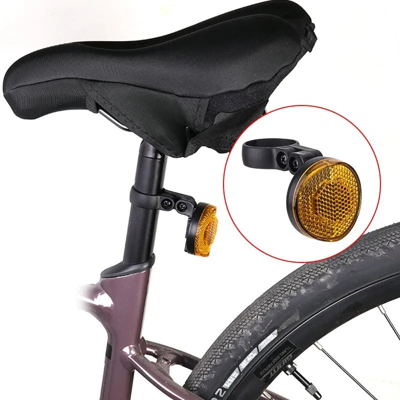 Red and yellow anti-theft bicycle taillight bracket for seat post mounting with reflective surfaces