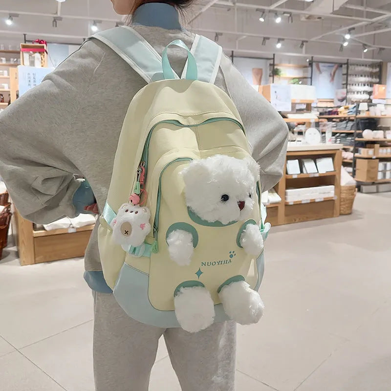 Junior high school college backpack made from nylon with 20-35L capacity, featuring curved shoulder straps for burden reduction, available in macaron colours including black, blue and pink, green pink, yellow green, and yellow pink