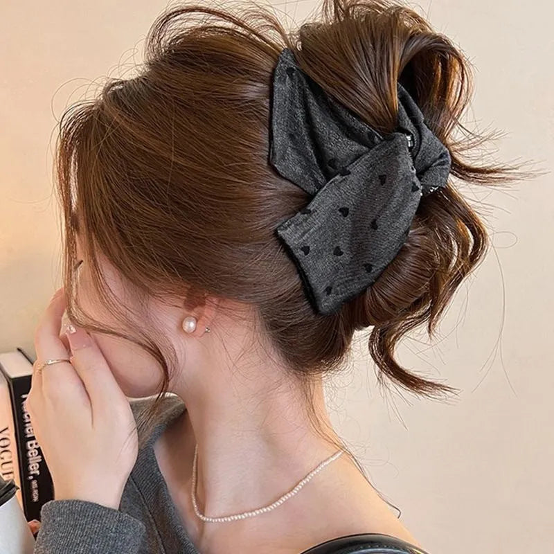 Handmade fabric bow hair grip with triangle grip design and plastic hairpin