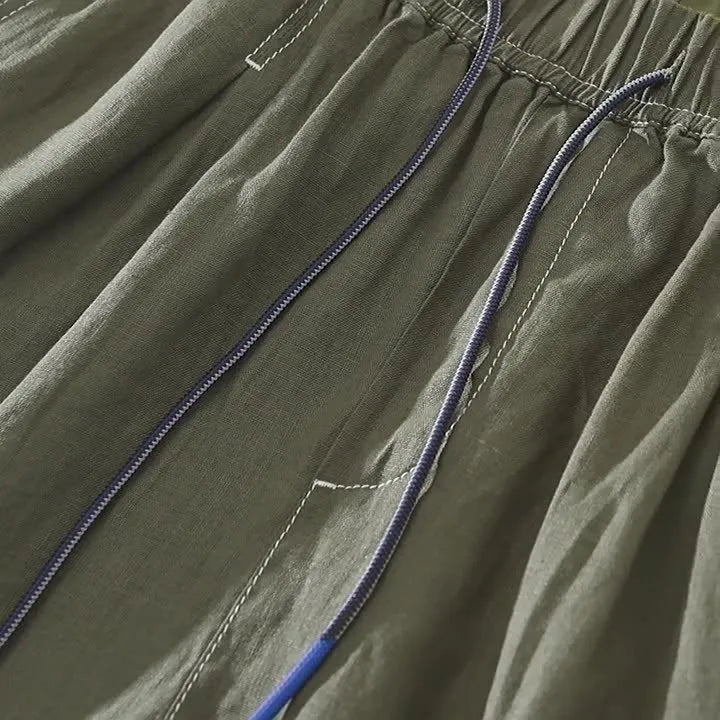 Men's solid colour linen shorts in loose straight drooping style on hanger