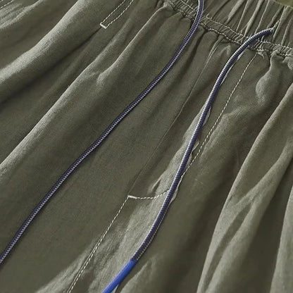 Men's solid colour linen shorts in loose straight drooping style on hanger