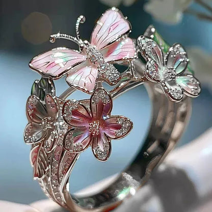 Adjustable crystal butterfly flower ring in gold, silver, and rose gold finishes