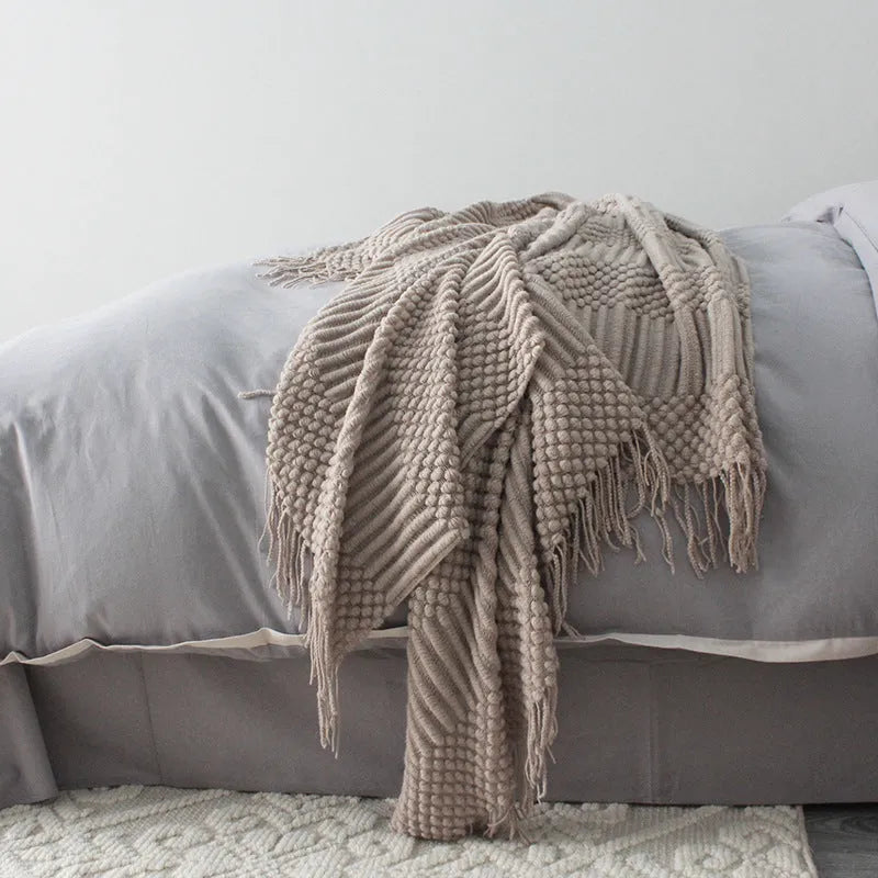 Polyester small blanket shown in dark grey, measuring 127 by 170 centimetres.