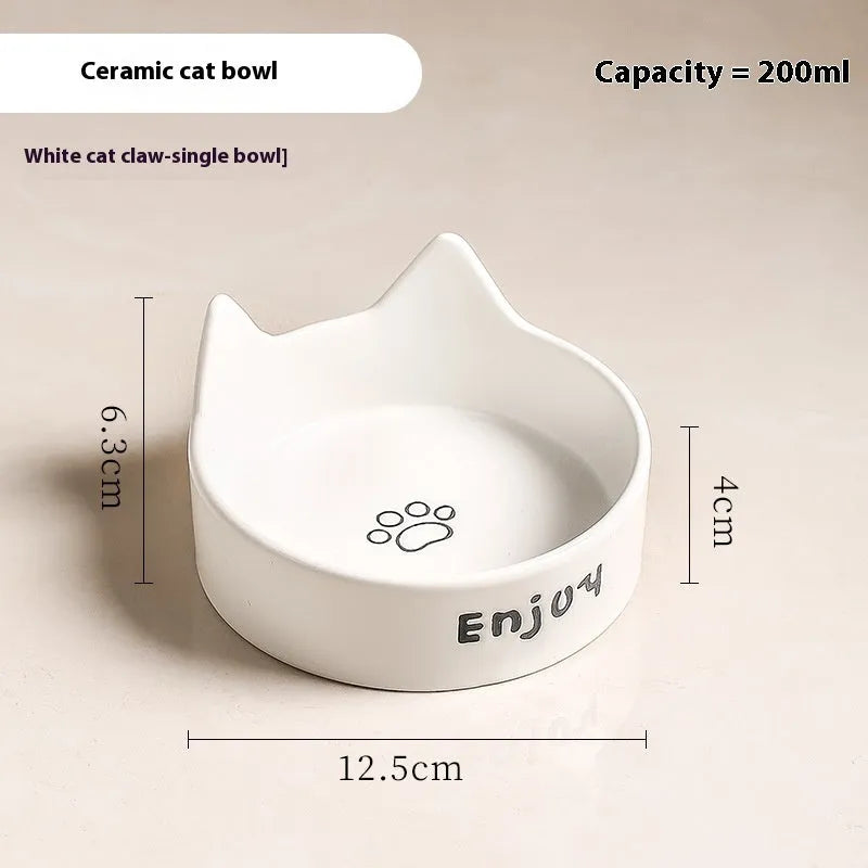 Porcelain cat bowl with anti-tumble wooden frame in pink with a cat paw design