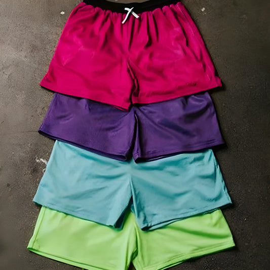 Men's black athletic shorts with grey mesh side panels for breathability, laid flat on a surface.
