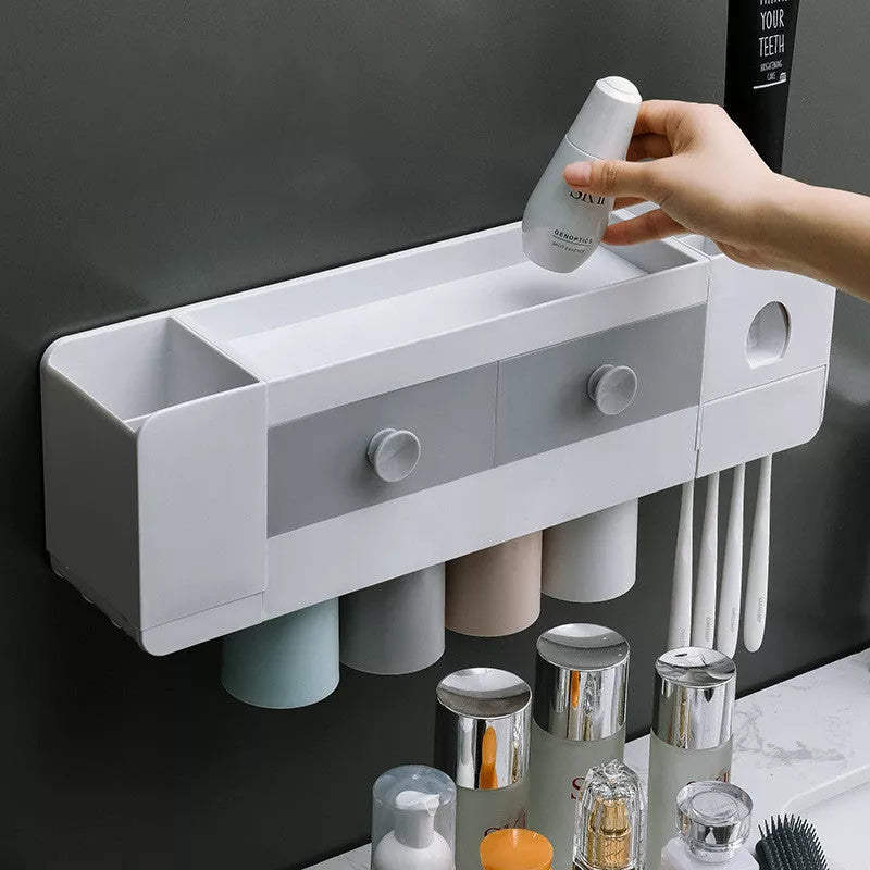 Wall-mounted magnetic toothbrush rack with automatic toothpaste dispenser in white plastic