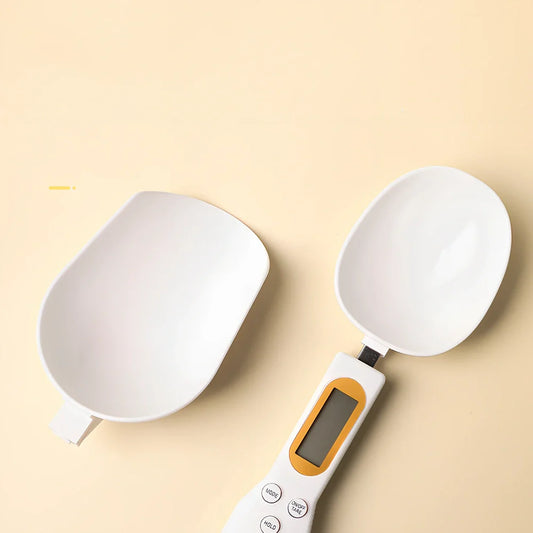Digital kitchen spoon scale showing measurement display and USB charging port