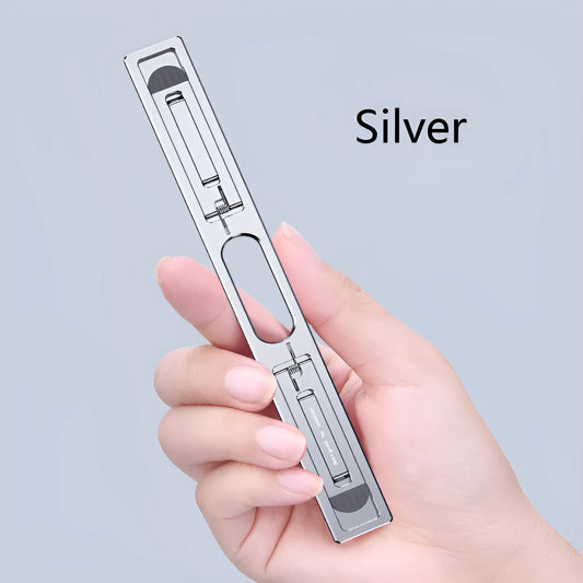 Silver aluminium laptop cooling bracket with adjustable height on wooden desk
