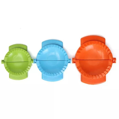 Plastic dumpling maker device in blue, green, and white for quick, uniform dumplings