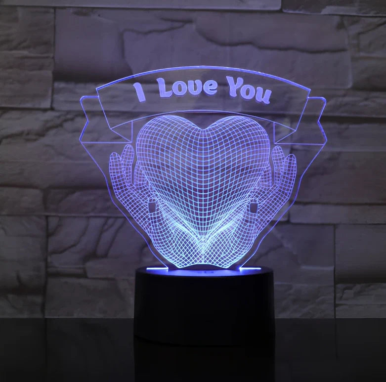 3D acrylic night light with hands holding heart design, showing seven colour options and remote control