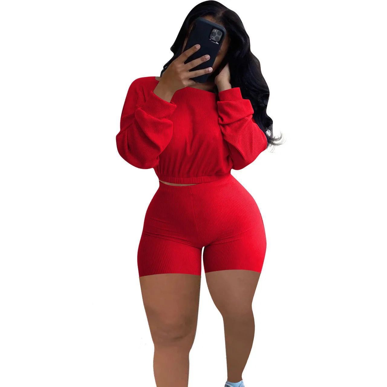 Women's long sleeve off-the-shoulder top and shorts two-piece set in a solid colour.