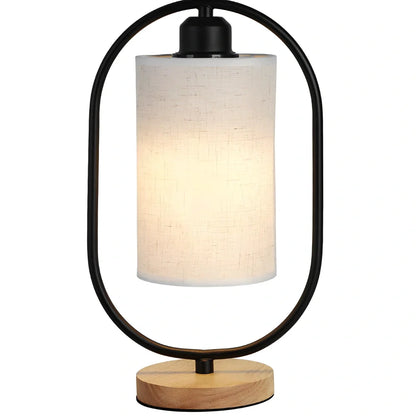 Black metal bedside lamp with dimming button and 5W LED warm light on wooden table