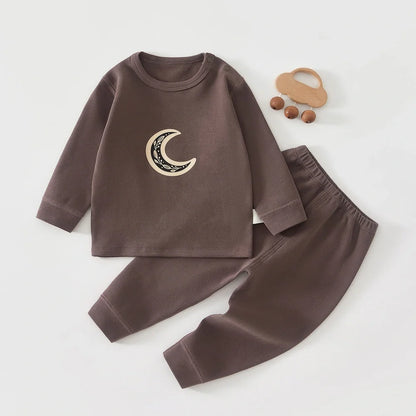 Baby wearing long-sleeved cotton pajamas with cartoon pattern, available in heights 66-120cm