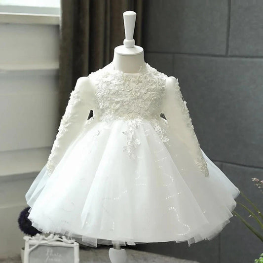 Baby girl wearing long sleeve princess dress in red, suitable for flower girl or wedding occasions