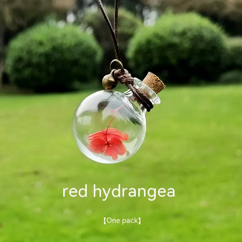 Glass fire extinguisher-shaped car perfume pendant with preserved flowers inside