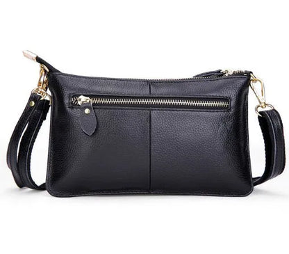 Lady's cowhide slant bag in apricot colour showing front view with strap and compact 24 cm size.