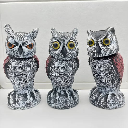 Set of artificial owl bait ornaments with shaking heads for scaring birds outdoors.