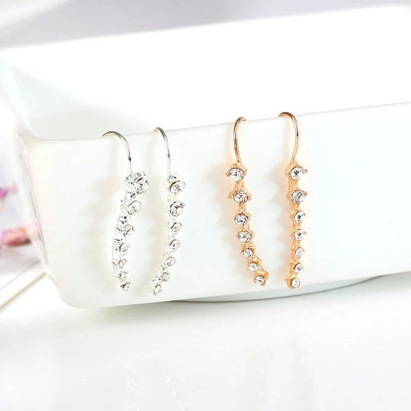 Elegant 7-inch rhinestone bridal earrings sparkling on a white background