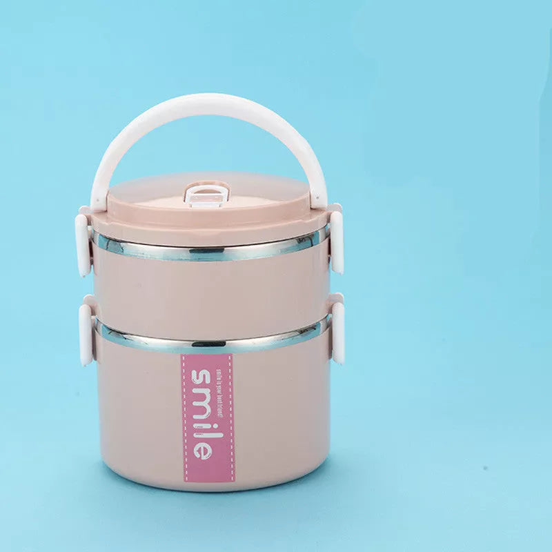 Stainless steel lunch box with built-in spoon, leak-proof design, available in green, pink, and blue