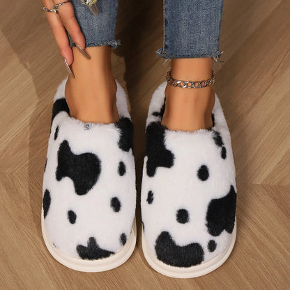 Cozy plush cow-print slippers with non-slip soles for comfortable indoor wear
