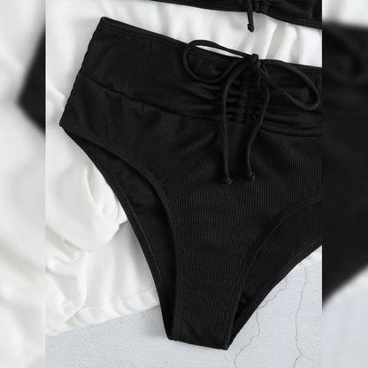 Black women's bikini with high waist and sling split design, shown as a two-piece set.
