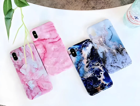 Colourful stone pattern soft back phone case for iPhone on a table.