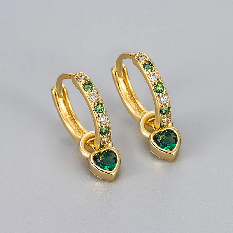 Fashion zircon earrings with 10mm heart-shaped drops in gold and white gold settings, showing diamond-treated stones
