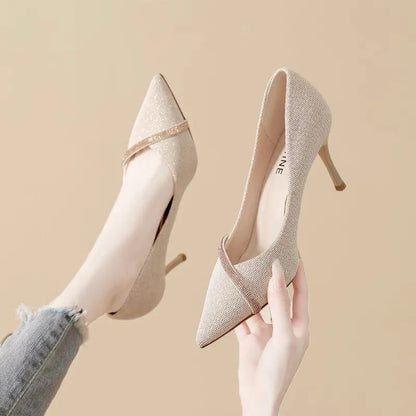 Women's black and gold pointed toe stiletto high heels with low-cut vamp