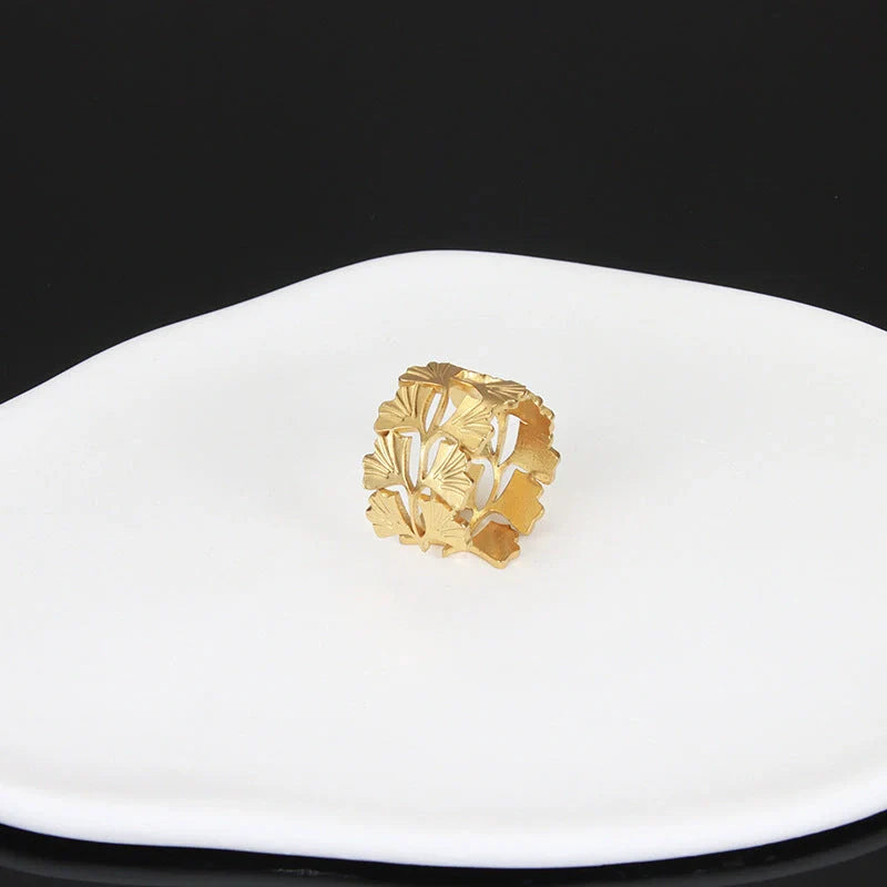 Adjustable stainless steel finger ring with unique charm designs in various colors