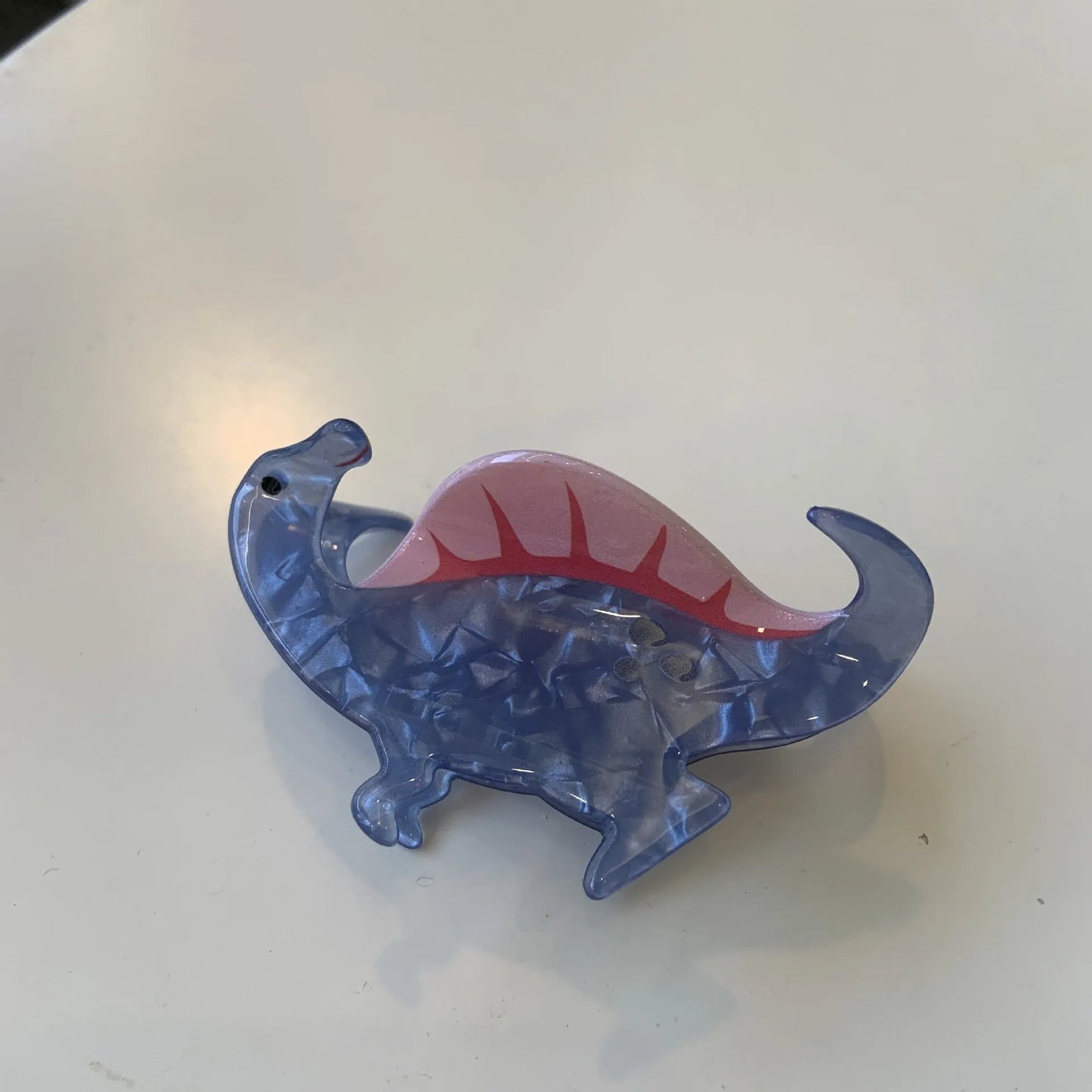 Acrylic dinosaur jaw clip hairpin showing six colour variations: pink, green, purple, blue, brown