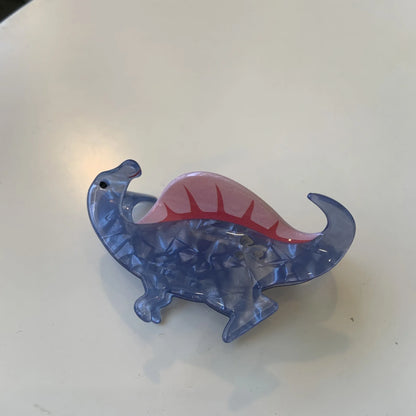 Acrylic dinosaur jaw clip hairpin showing six colour variations: pink, green, purple, blue, brown