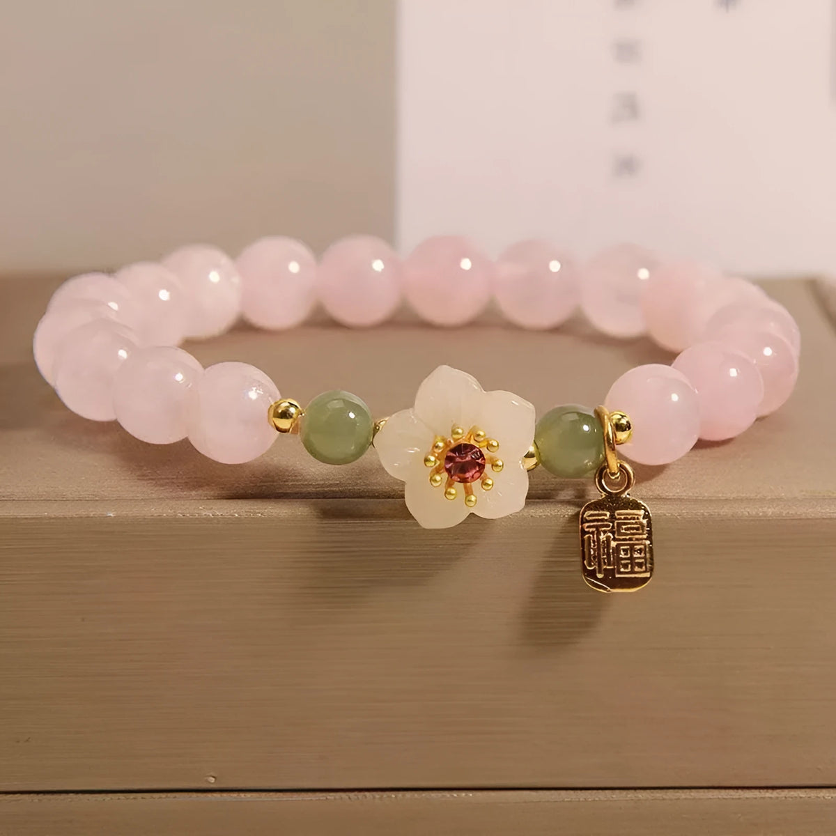 Crystal and Hetian jade beaded bracelet with peach blossom and camellia design in blessing card colour.