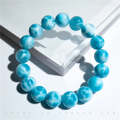Blue bodhi bracelet with pearl accents showing bead sizes from 6mm to 14mm in Maillard style design