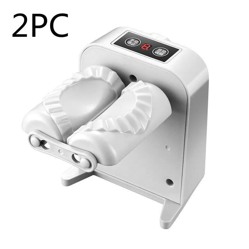 White automatic electric dumpling maker machine with USB cable, brush, and spoon.