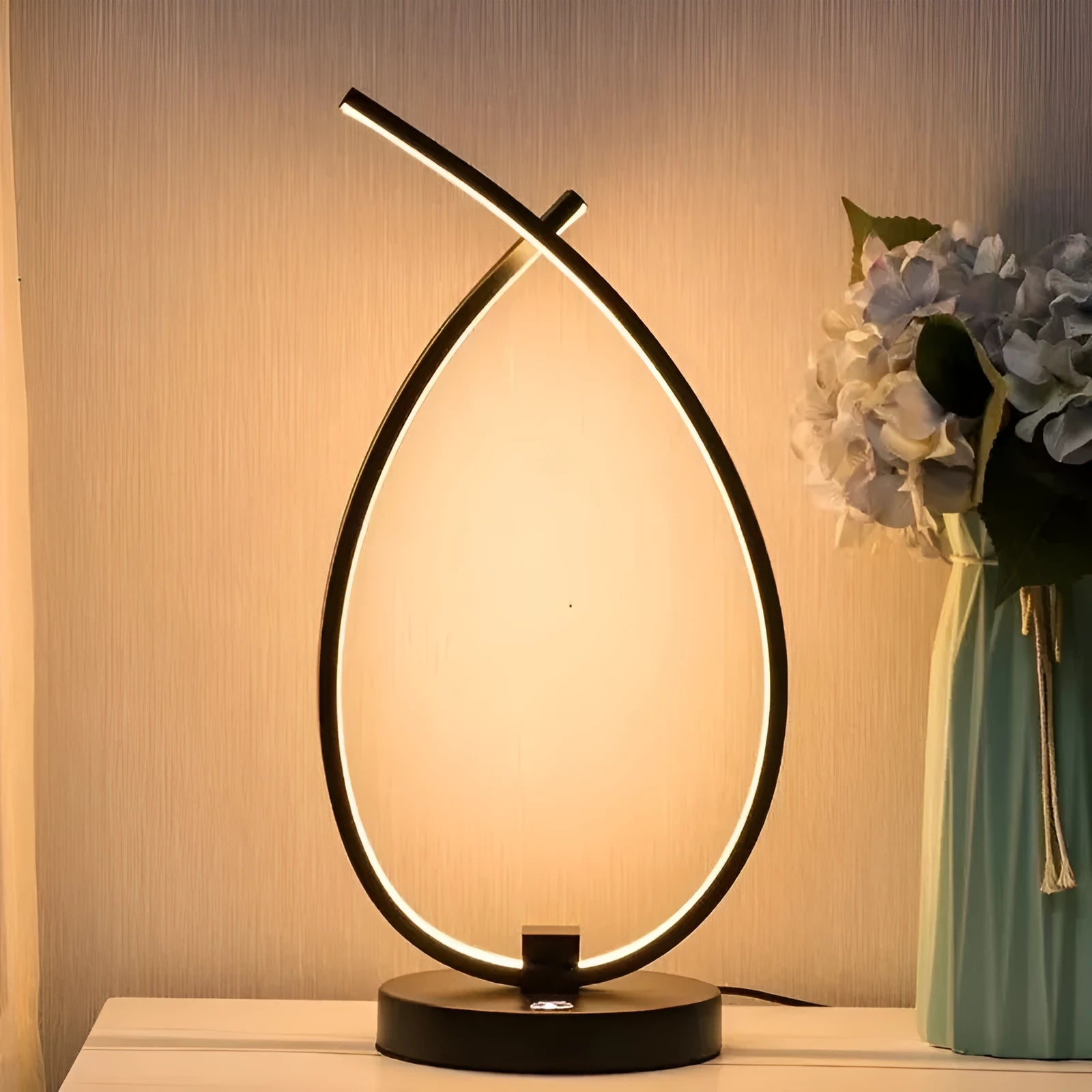 Black or white water drop shaped USB table lamp with touch control measuring 30cm tall