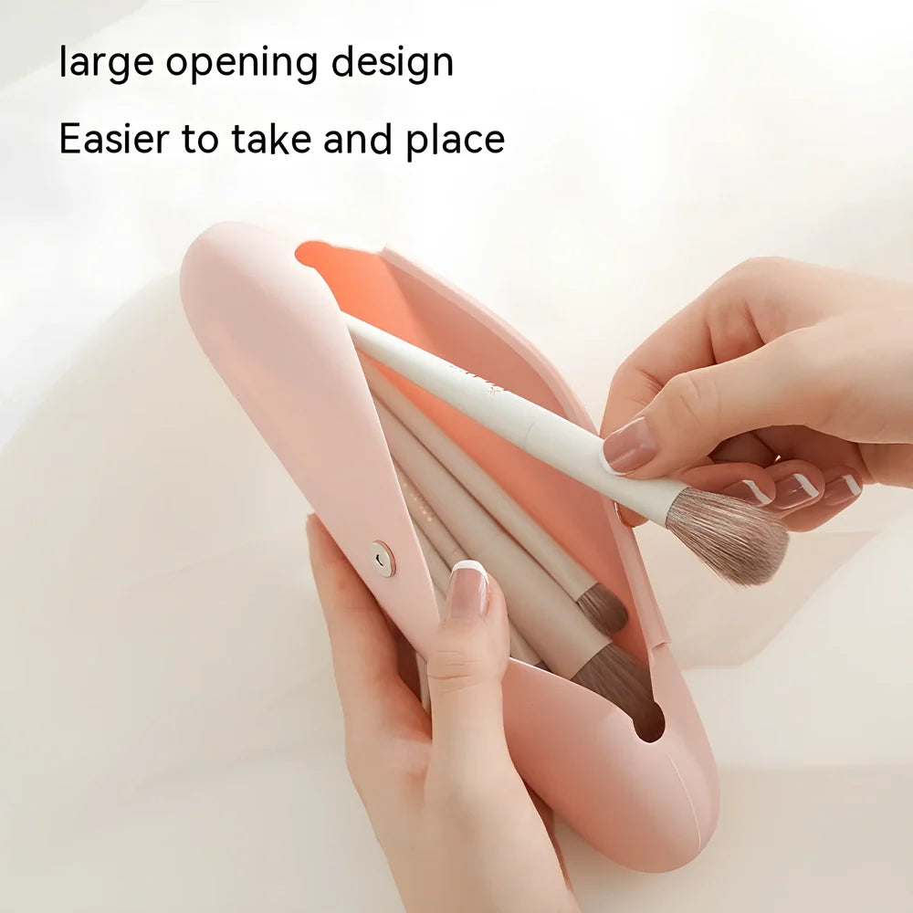 Pink silicone buggy bag for travel makeup, handbag shape, 20cm long, organises cosmetics for business trips