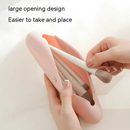 Pink silicone buggy bag for travel makeup, handbag shape, 20cm long, organises cosmetics for business trips