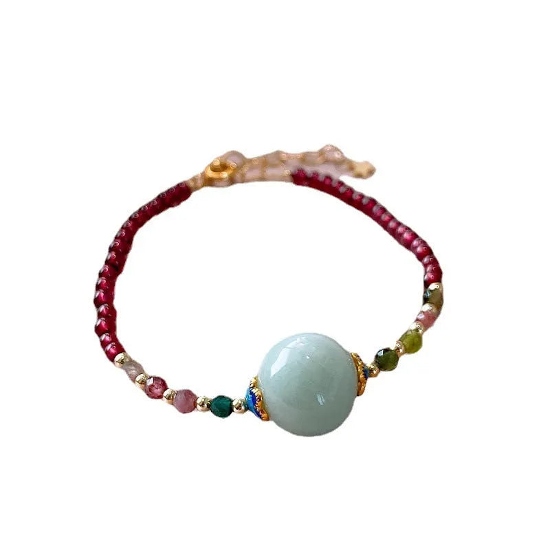 Aquamarine coloured drop shape tourmaline bracelet with garnet electroplated finish
