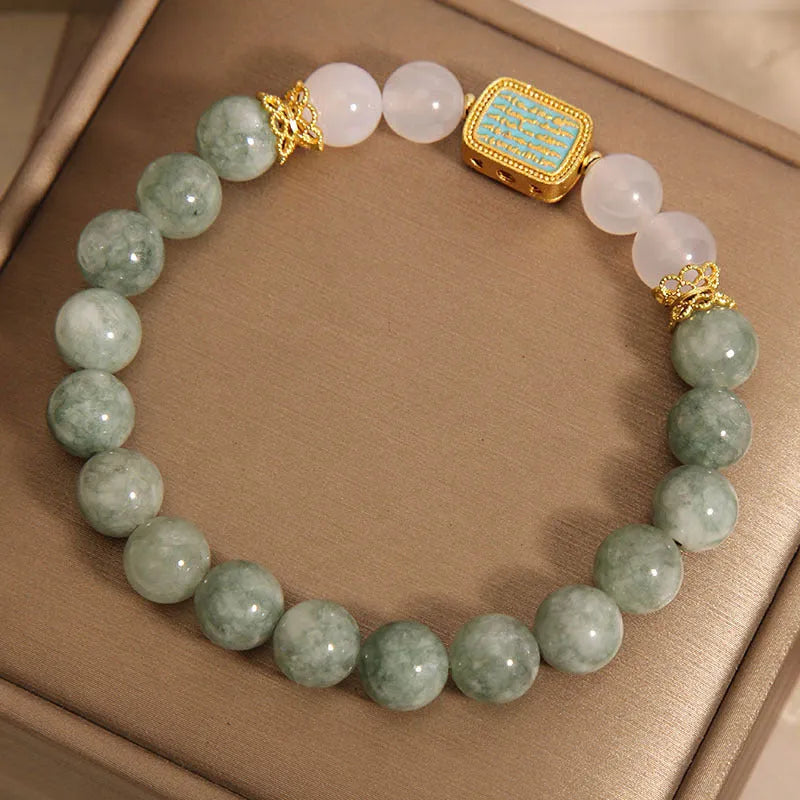 Women's bracelet with five oil green emerald crystal stones in a scripture charm design.