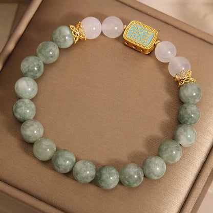 Women's bracelet with five oil green emerald crystal stones in a scripture charm design.
